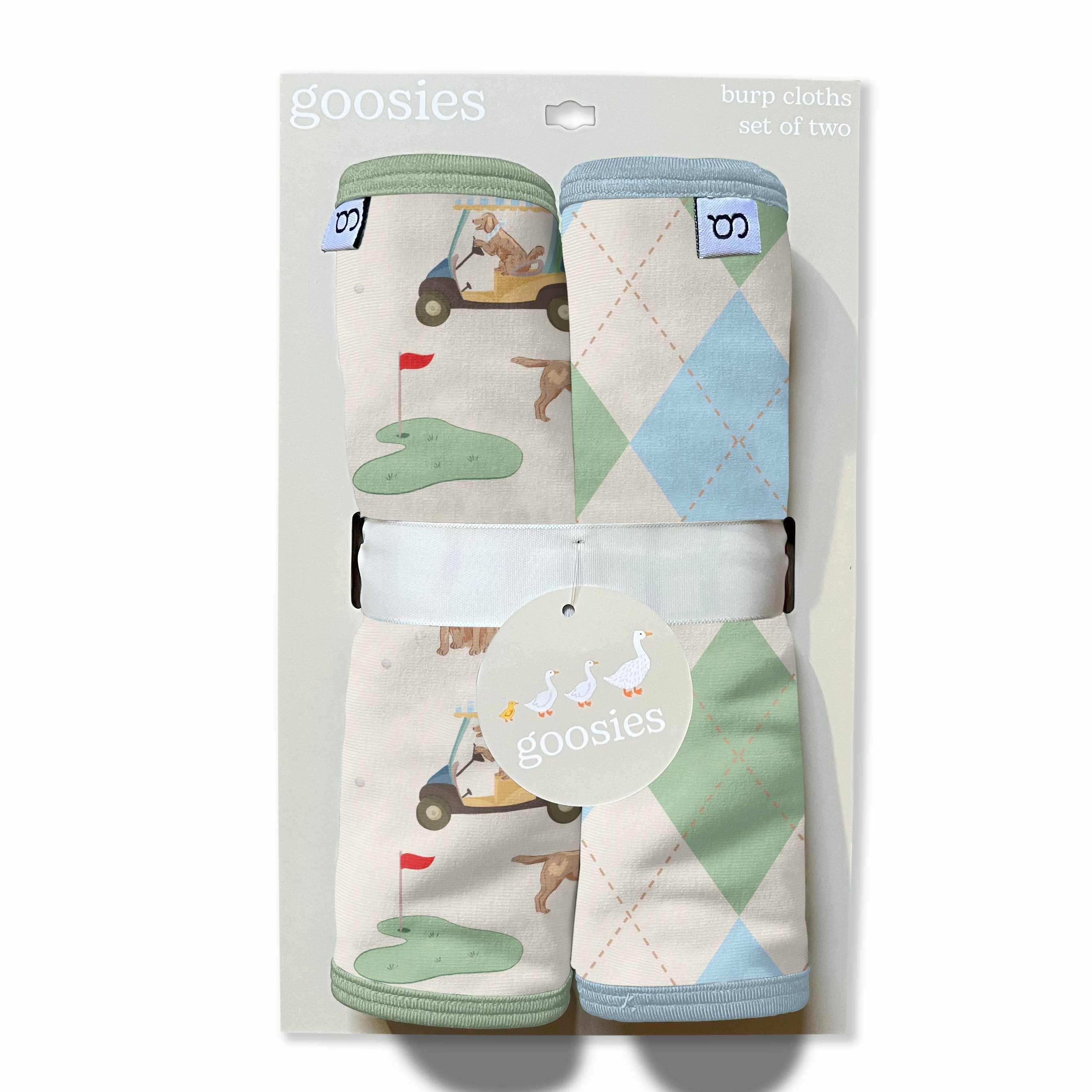 Packaged baby products with geometric patterns on a white background