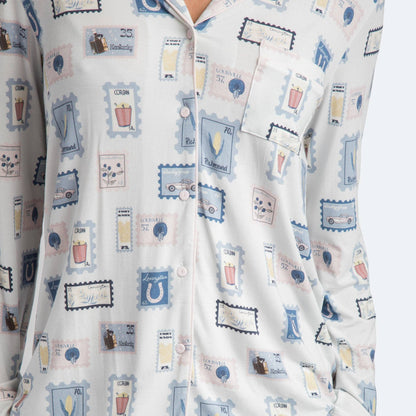 Patterned pajama set with cartoon-like illustrations on a white background