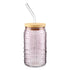 Lilac purple textured glass drink tumbler with a wooden lid on a white background