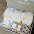 An open gift box labeled &