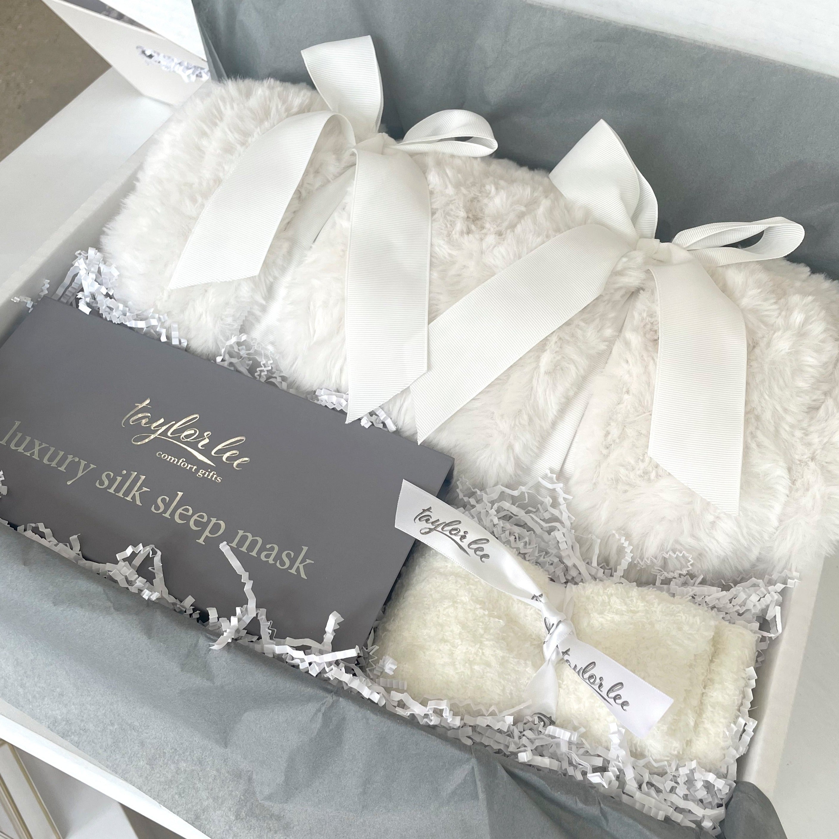 Plush Ivory blanket and soft cozy socks in beautiful gift box. 