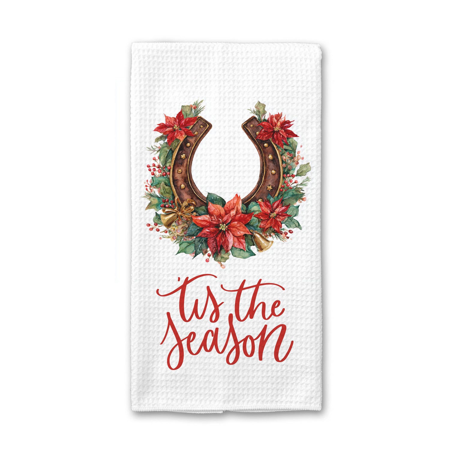 A white waffle-weave kitchen towel featuring a festive graphic with a brown horseshoe wreath decorated with red poinsettias and green leaves, above the red cursive text &