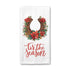 A white waffle-weave kitchen towel featuring a festive graphic with a brown horseshoe wreath decorated with red poinsettias and green leaves, above the red cursive text &