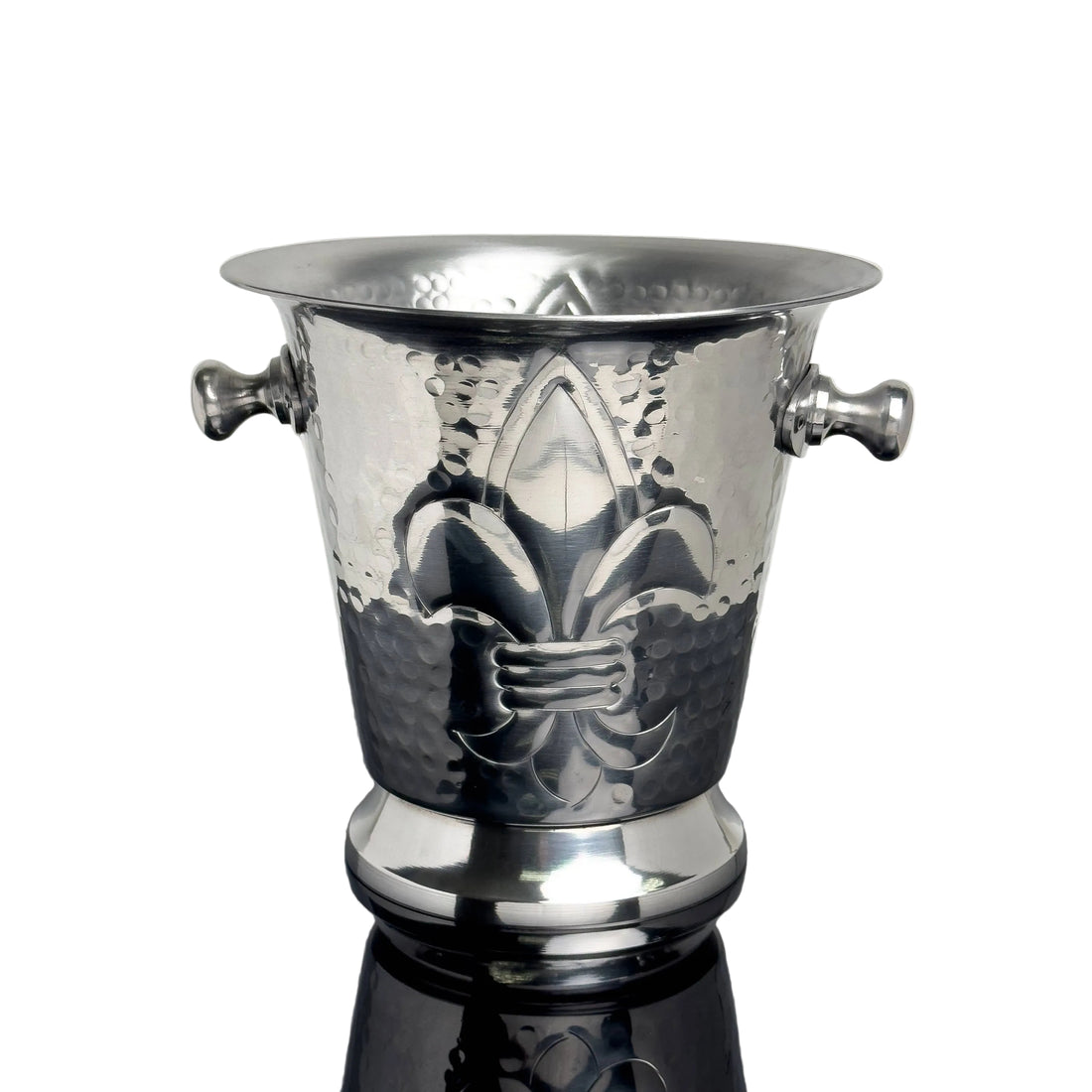 Silver wine cooler with fleur-de-lis design on a reflective surface